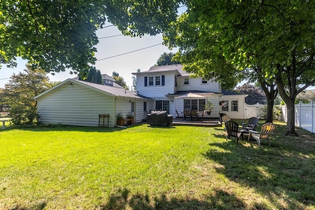 back of property with a patio and a lawn