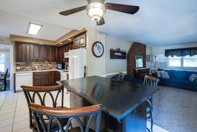 interior space featuring ceiling fan and sink