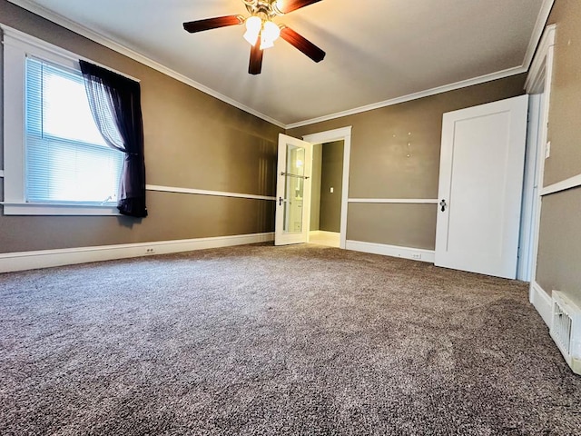 unfurnished bedroom with carpet floors, ceiling fan, and crown molding