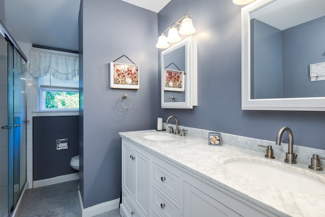 bathroom with toilet, a shower with door, tile patterned flooring, and vanity