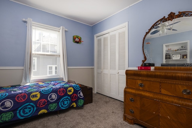 carpeted bedroom featuring a closet