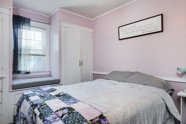 bedroom with crown molding