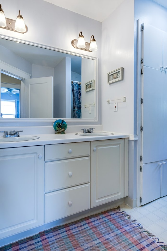 bathroom featuring tile patterned floors and vanity