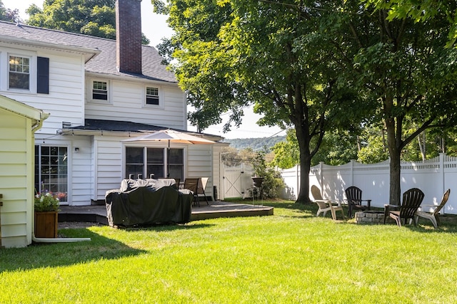 view of yard with an outdoor fire pit