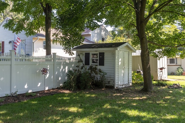 view of outbuilding with a lawn