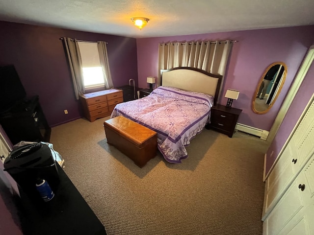 bedroom with light colored carpet, a closet, and a baseboard heating unit