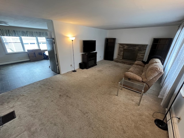 living room featuring a stone fireplace, light carpet, and a baseboard heating unit