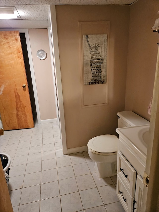 bathroom featuring toilet, tile patterned flooring, and vanity