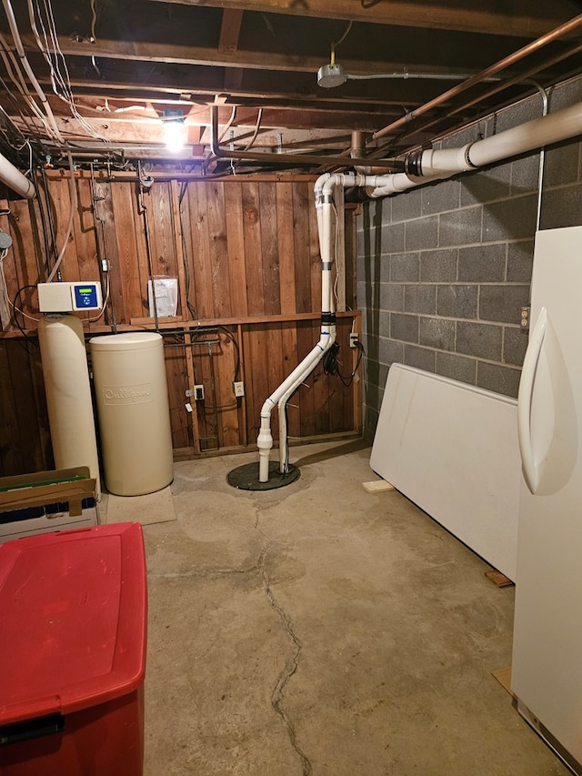 basement with white fridge