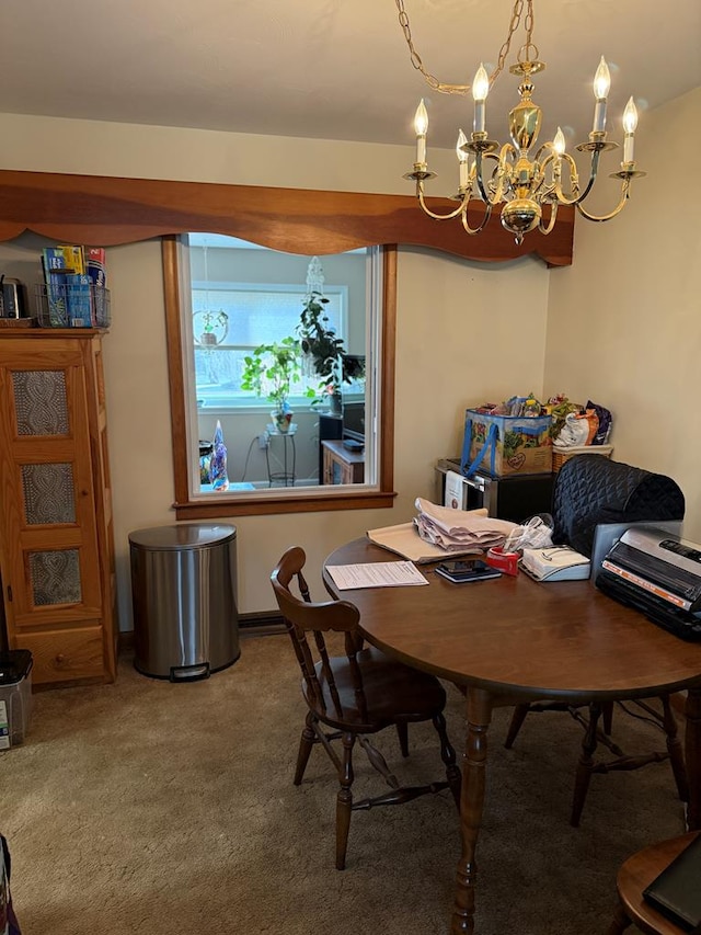 dining area with carpet and an inviting chandelier