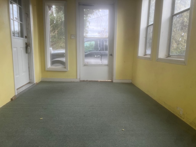 unfurnished sunroom featuring plenty of natural light