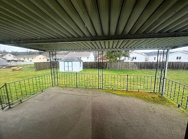 view of patio / terrace with a shed