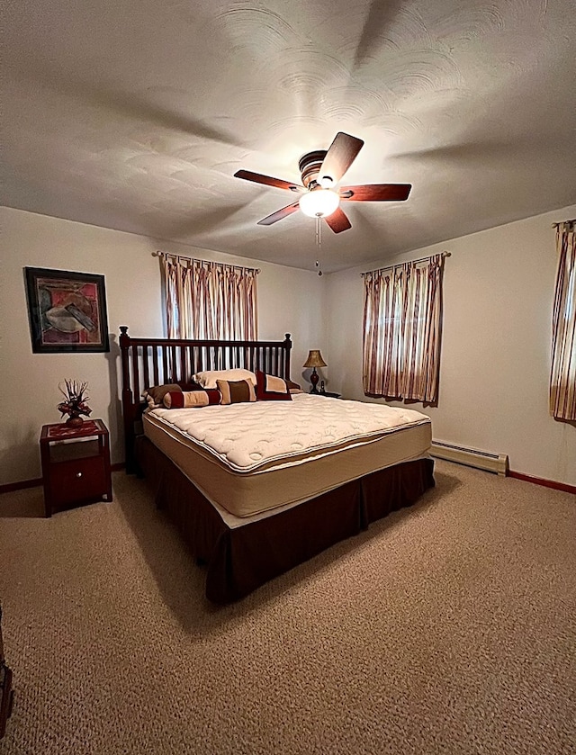 bedroom featuring baseboard heating, a textured ceiling, ceiling fan, and carpet flooring