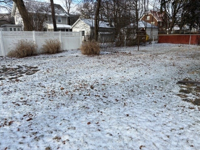 view of yard layered in snow