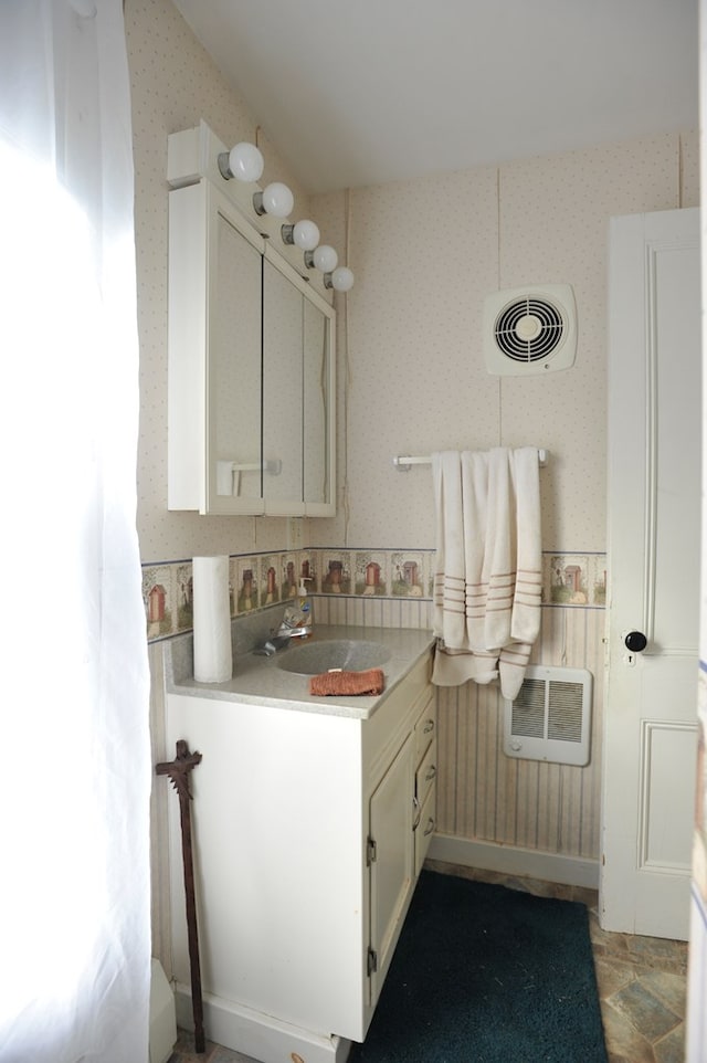 interior space featuring sink and heating unit