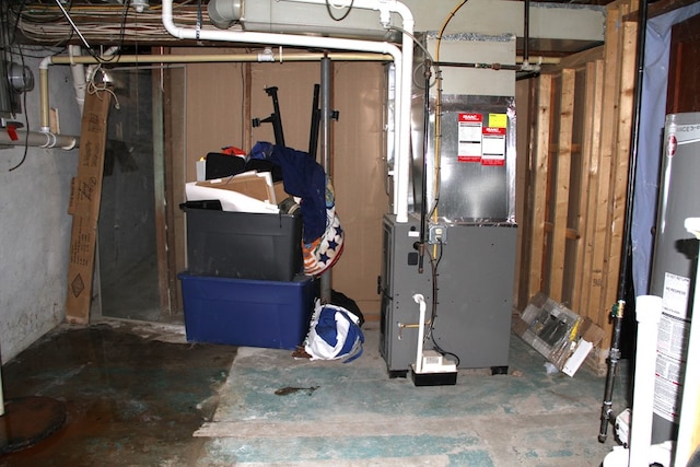 utility room featuring heating unit