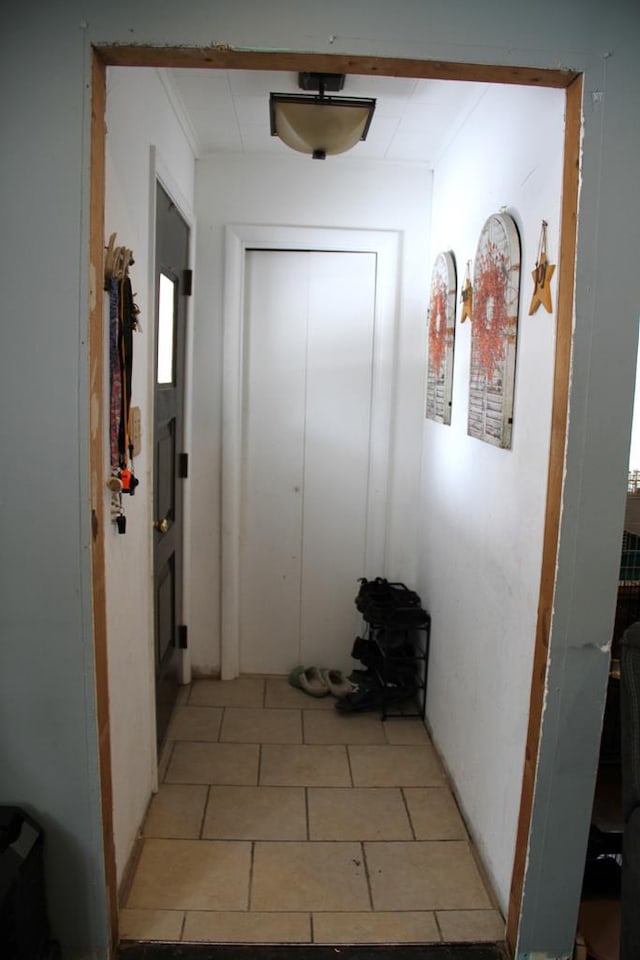 corridor featuring light tile patterned floors