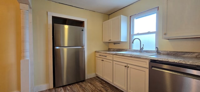 kitchen with white cabinetry, stainless steel appliances, dark wood-type flooring, and sink