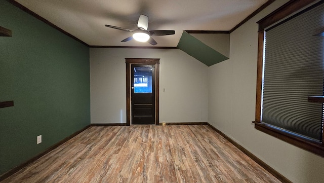 bonus room with wood-type flooring and ceiling fan