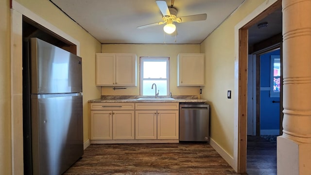 kitchen featuring sink, ceiling fan, appliances with stainless steel finishes, white cabinetry, and dark hardwood / wood-style floors