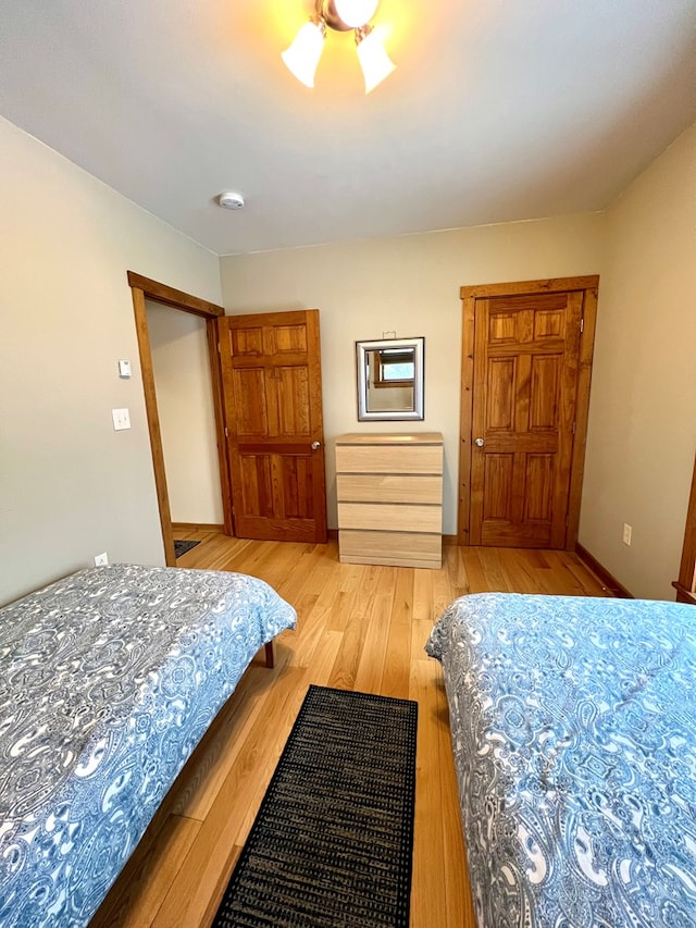 bedroom with light wood-type flooring