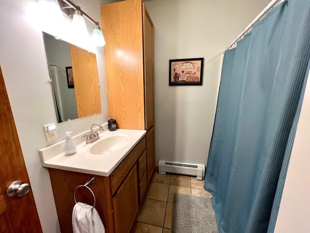 bathroom featuring vanity, a baseboard heating unit, and tile patterned floors