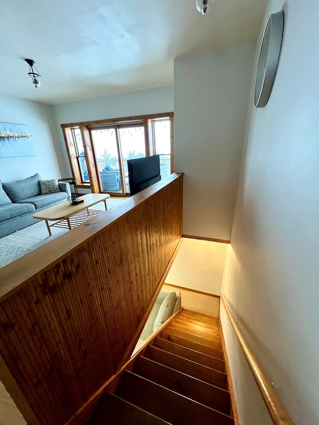 stairs featuring wood-type flooring