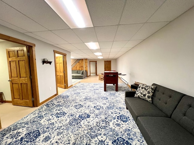 carpeted living room with a paneled ceiling