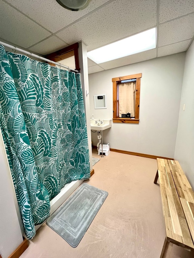 bathroom with sink and a drop ceiling