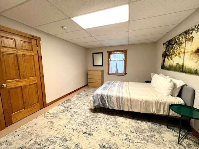 bedroom featuring a drop ceiling