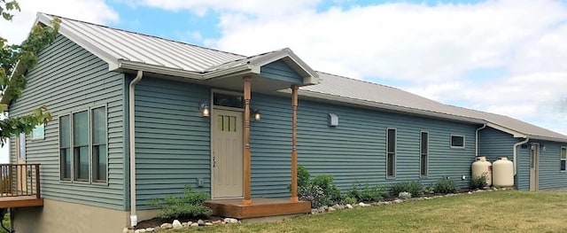 view of side of home featuring a lawn