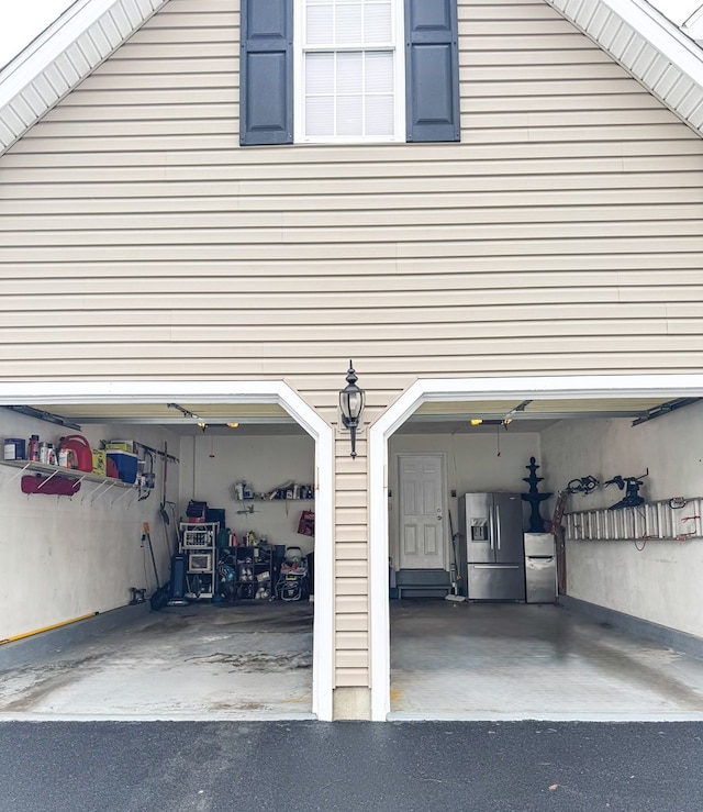 garage featuring stainless steel fridge