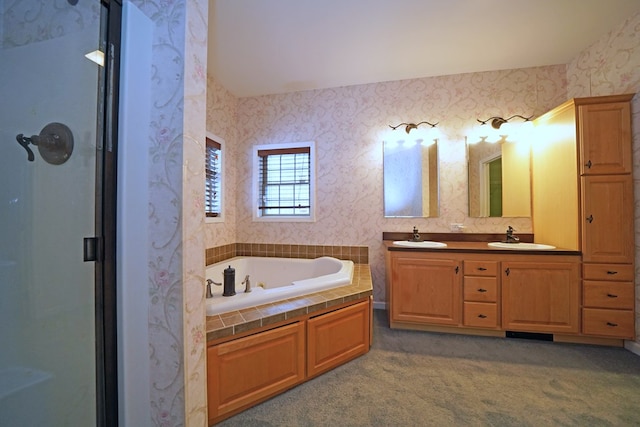 bathroom with vanity and separate shower and tub