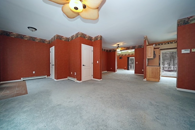 unfurnished living room featuring baseboard heating, carpet floors, and ceiling fan