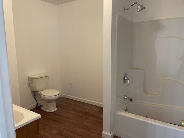 full bathroom featuring vanity, toilet, tub / shower combination, and wood-type flooring