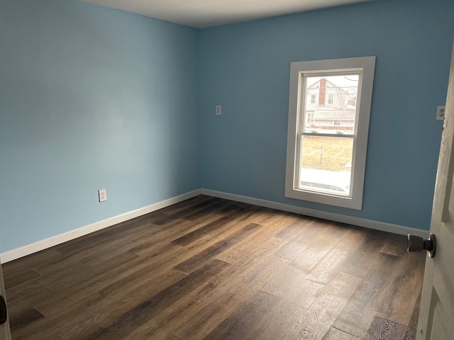 empty room featuring wood-type flooring