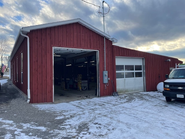 view of snow covered garage