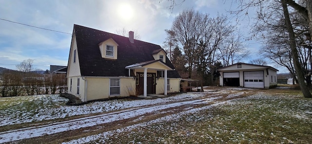 view of front of property with an outbuilding and a garage