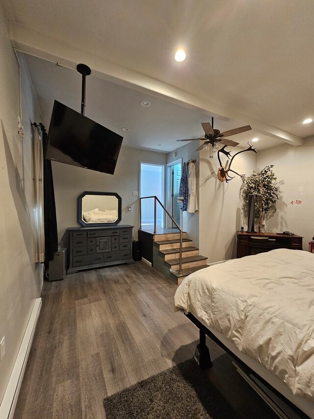 bedroom with hardwood / wood-style floors, a baseboard radiator, beamed ceiling, and ceiling fan