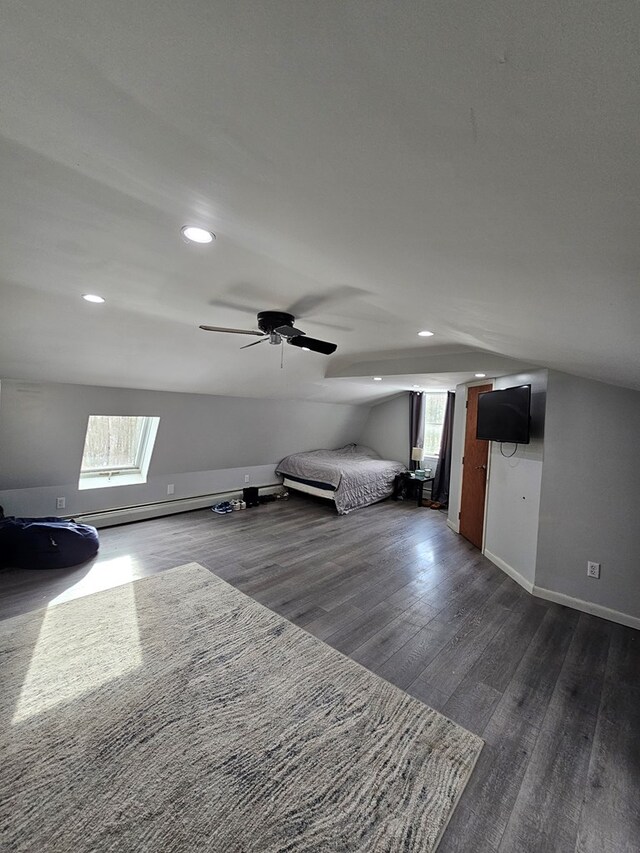 bonus room featuring ceiling fan, lofted ceiling, and dark hardwood / wood-style flooring