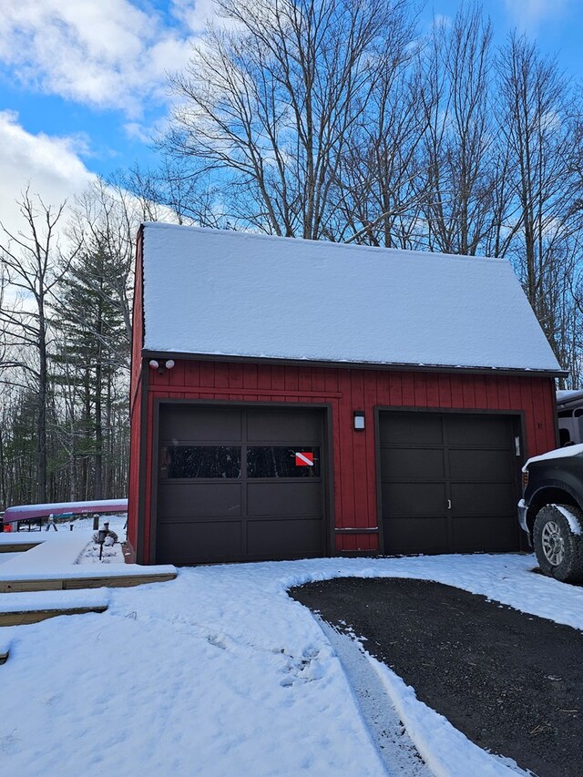 view of snow covered garage