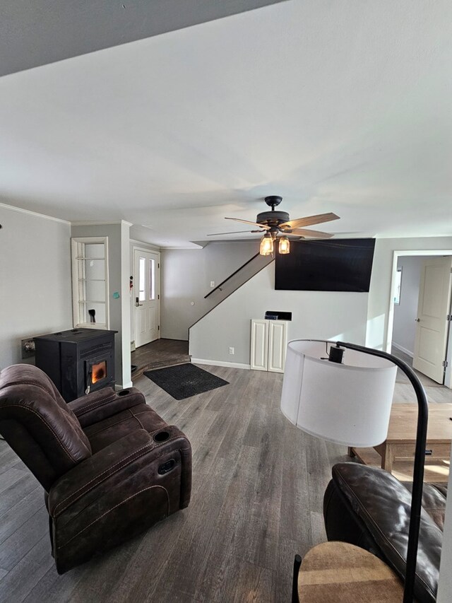 living room with hardwood / wood-style flooring and ceiling fan