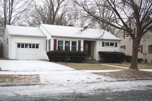 single story home featuring a garage