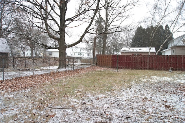 view of yard layered in snow