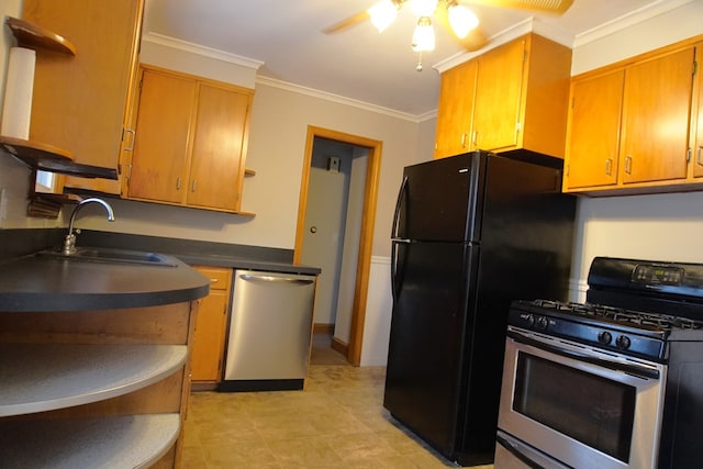 kitchen featuring ceiling fan, crown molding, stainless steel appliances, and sink