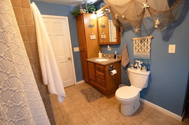 bathroom with vanity, toilet, and tile patterned flooring