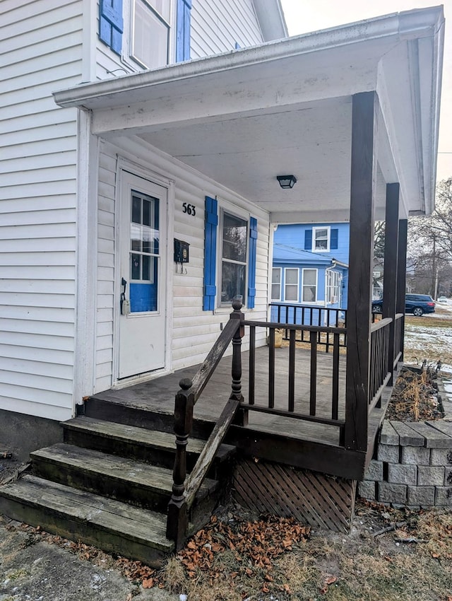 doorway to property featuring a porch