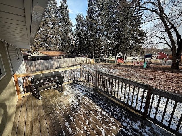 wooden deck featuring grilling area