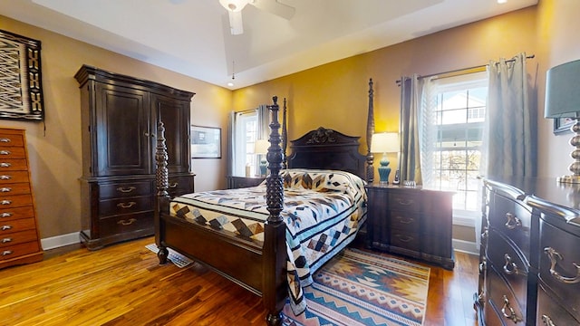 bedroom with hardwood / wood-style floors and ceiling fan