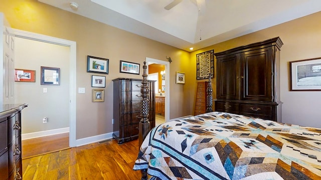 bedroom featuring wood-type flooring and ceiling fan